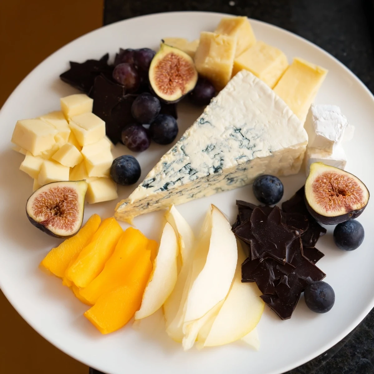 A beautifully arranged Celestial Night Board, overflowing with cheeses, charcuterie, and fresh fruits for serving.