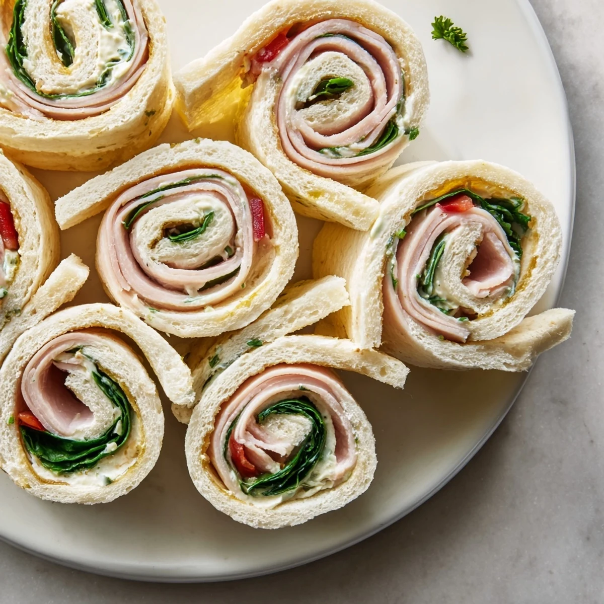 Star-shaped party sandwiches with melty cheese and deli meats, perfect for a festive gathering.