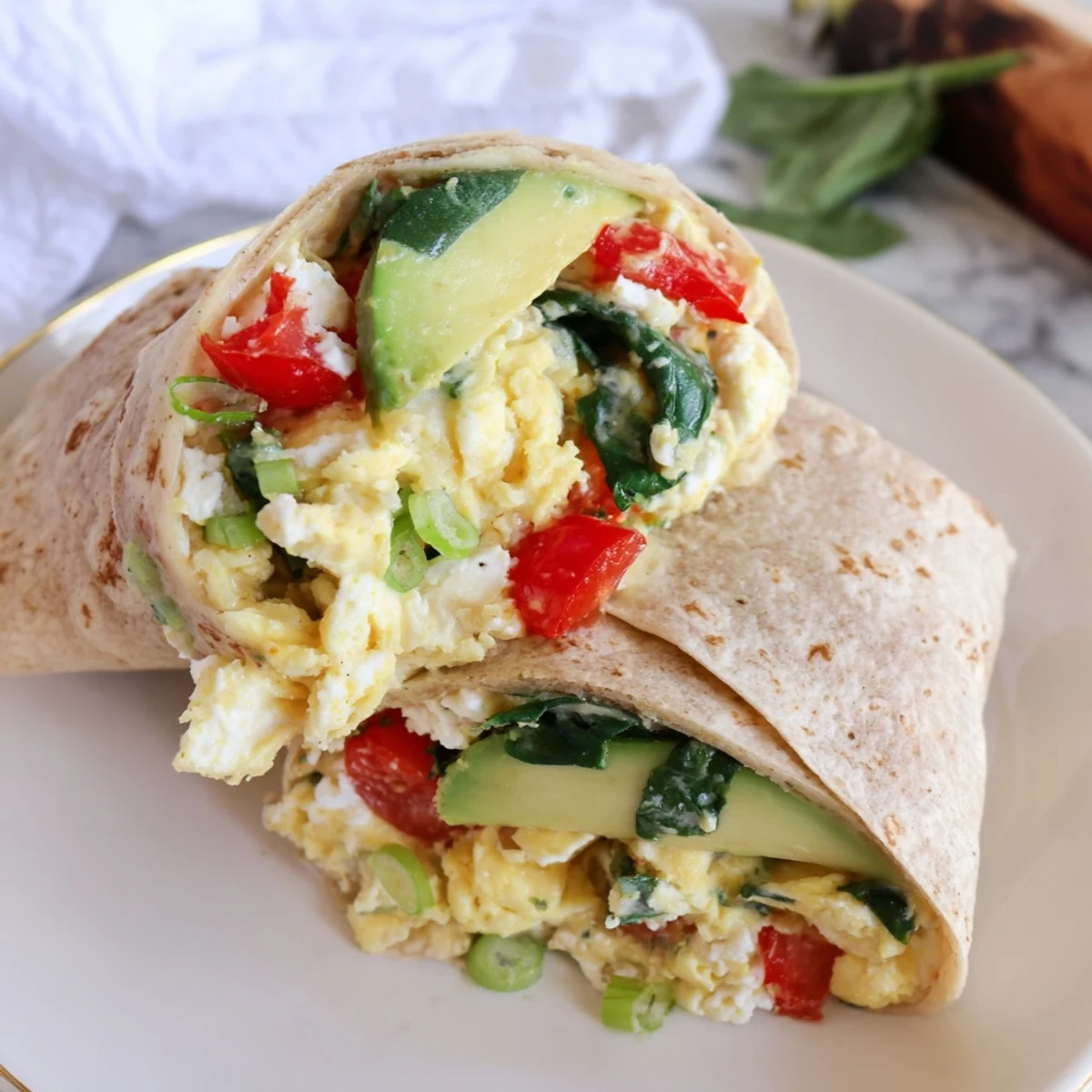 Fluffy Feta Egg Wrap filled with creamy feta and vibrant spinach, ready for a delicious breakfast.