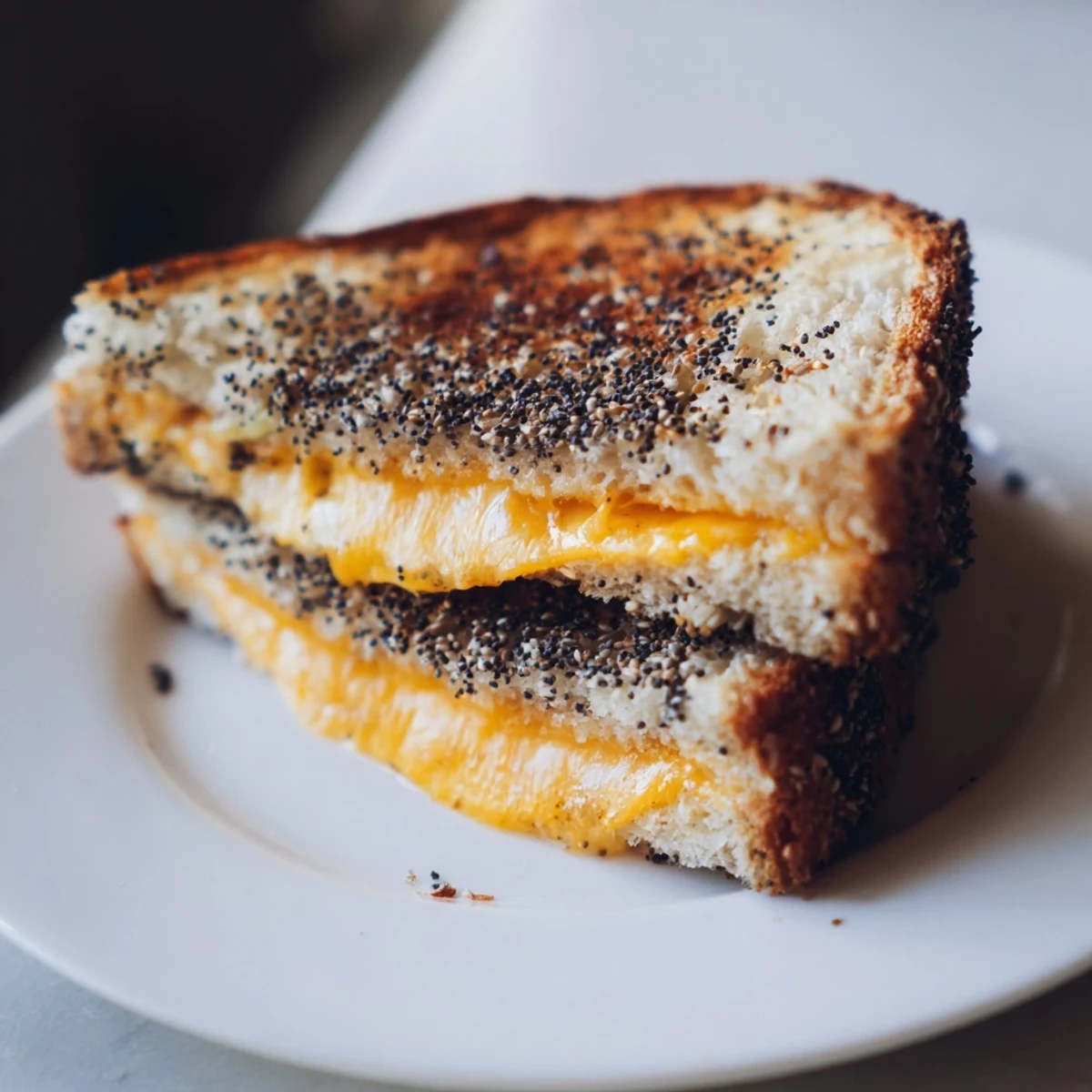 Enjoy a warm Everything Bagel Grilled Cheese, a flavorful and easy-to-make vegetarian meal.