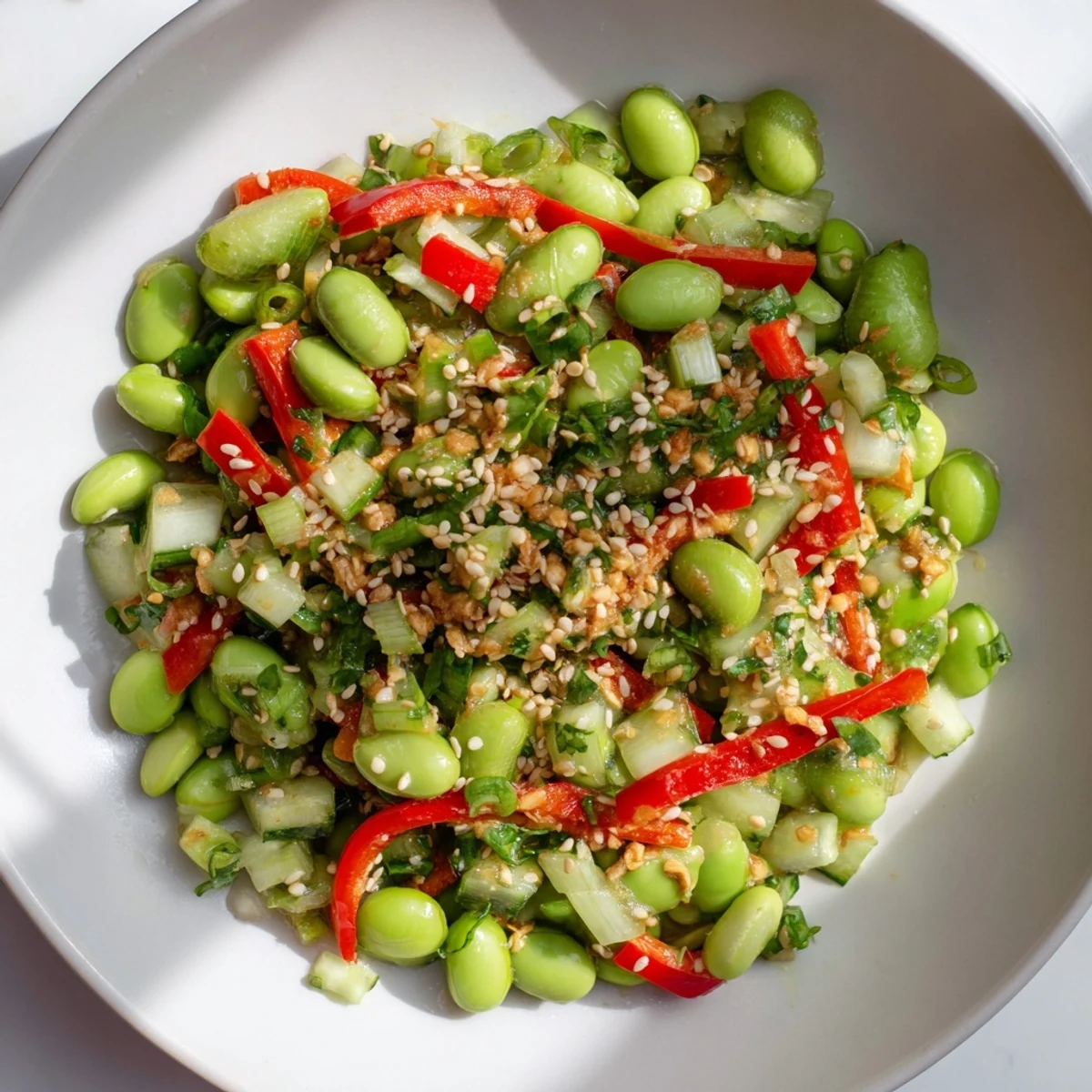 Vibrant edamame salad with crisp cucumber and savory sesame dressing, ready to enjoy.