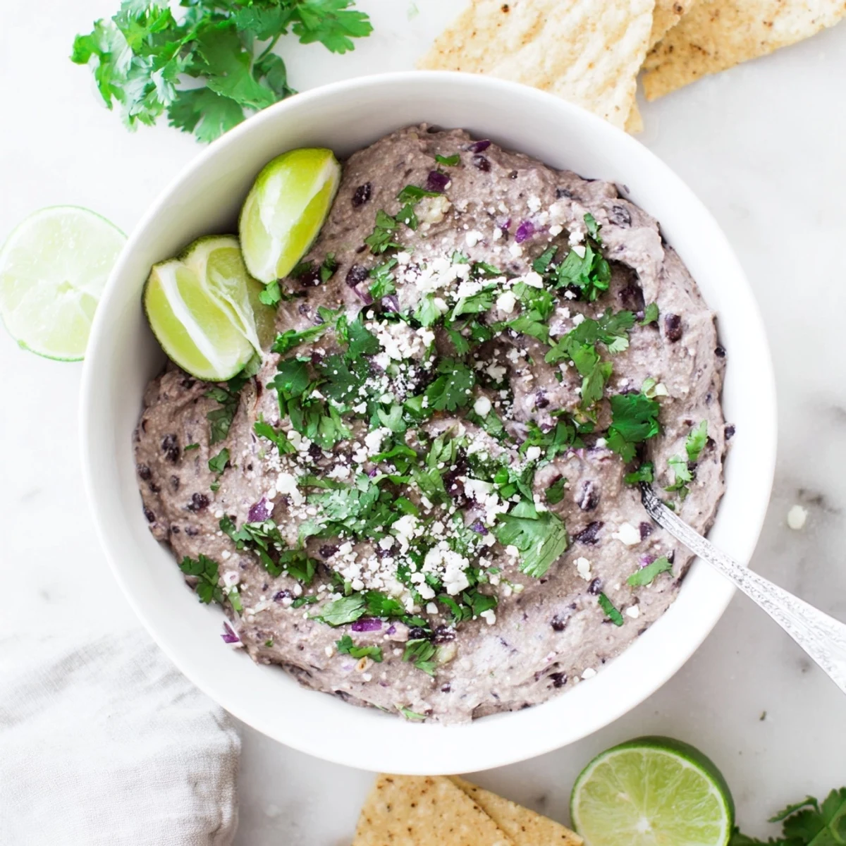 Vibrant bowl of homemade Spicy Black Bean Dip, a zesty Mexican-inspired appetizer perfect for game day or party snacking.  