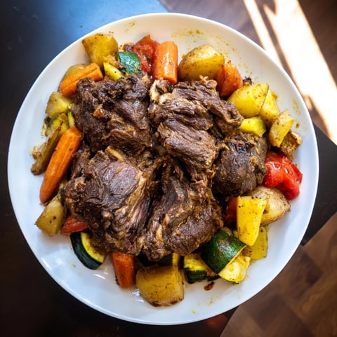 Tender Jordanian Zarb, with juicy lamb and vibrant vegetables, ready for your plate, wonderfully flavorful.