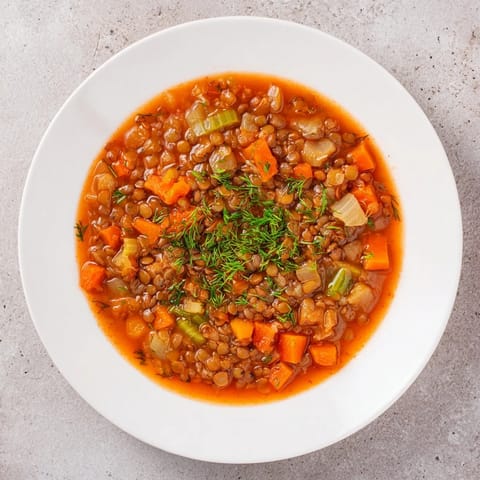 Steaming bowl of Classic Lentil and Herb Soup, ready to warm you on a chilly day.