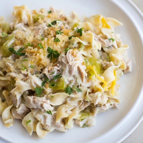 Golden-brown Homemade Tuna Noodle Casserole with a crispy Ritz cracker topping, ready to serve.