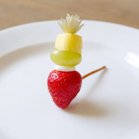 Christmas Light Fruit Skewers: vibrant, colorful fruit arranged on skewers, perfect for a holiday appetizer.