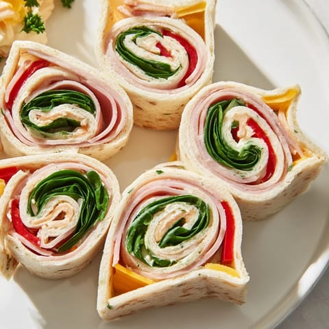 Freshly assembled party sandwiches, star-shaped and colorful, ready to be enjoyed as appetizers.
