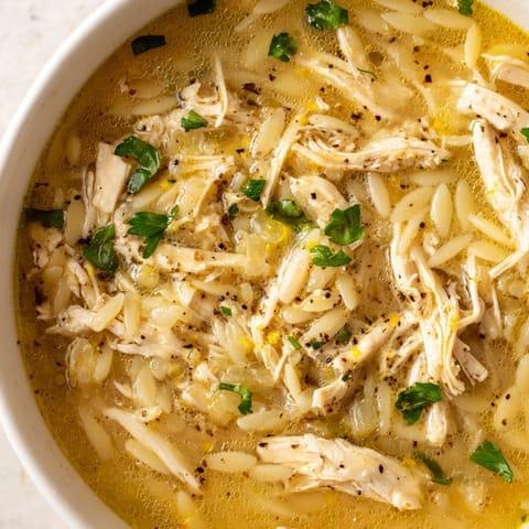 Spoon into this savory Lemon Pepper Chicken Orzo Soup, brimming with juicy chicken, orzo, and a zesty lemon-black pepper finish.  