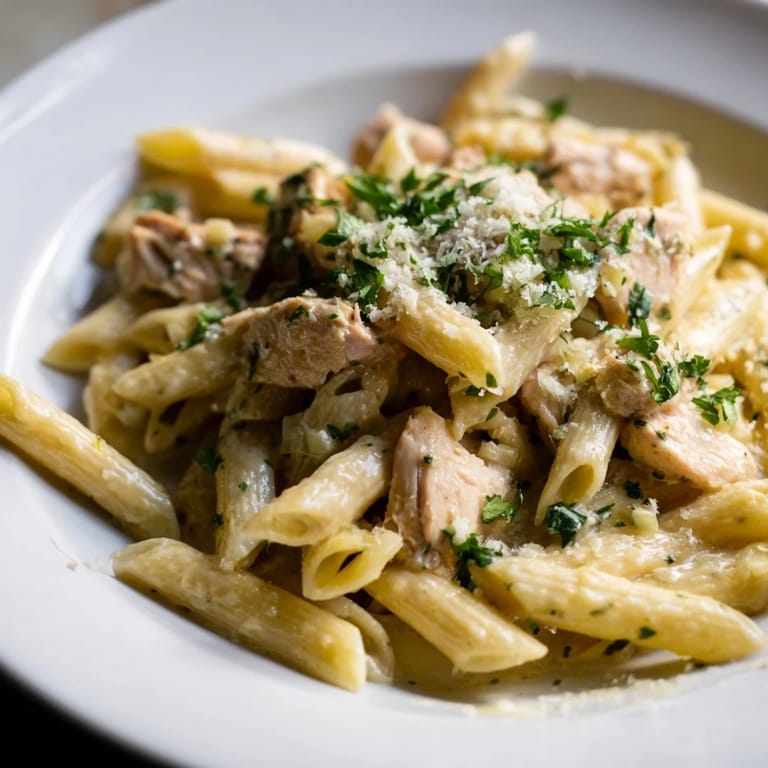 Golden Parmesan topping the savory One-Pot Christmas Pasta, a comforting blend of turkey and spinach.