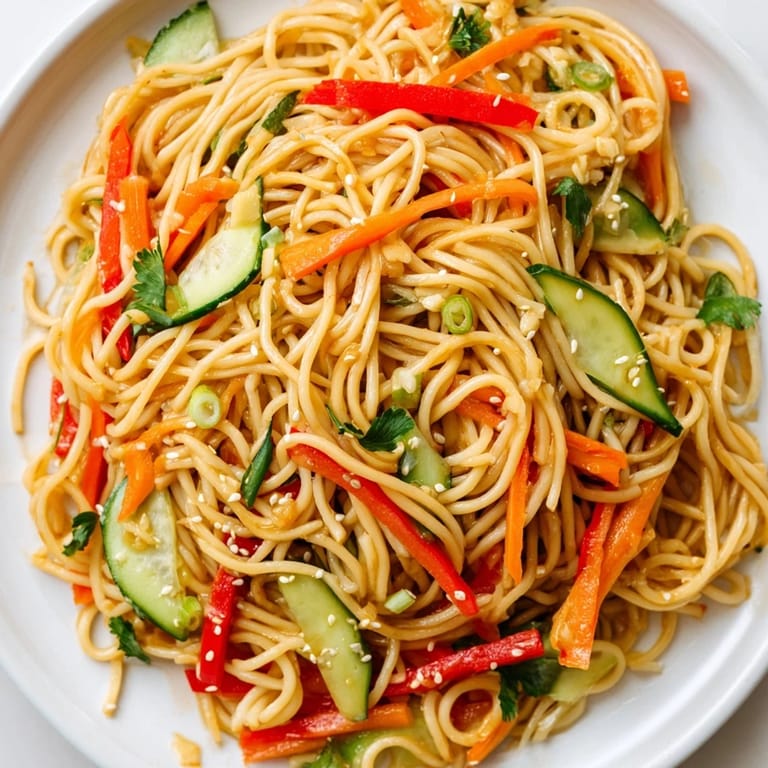 Cool, refreshing Garlic Noodle Salad: a vegetarian delight with bright vegetables and flavorful noodles.