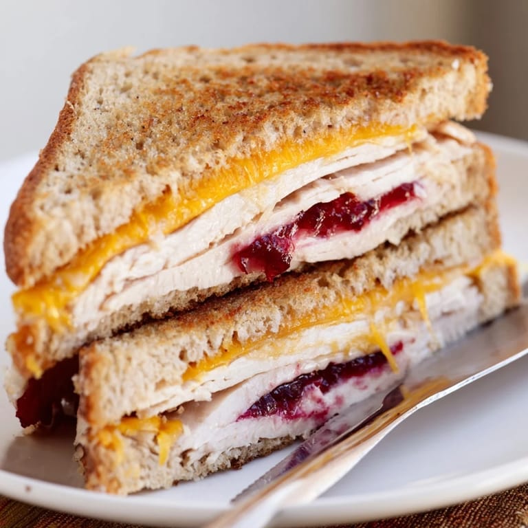 Served alongside a small green salad, the crispy sandwich offers a cozy and hearty lunch for two.