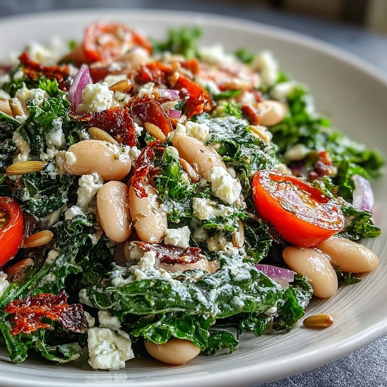 A nourishing bowl of white bean and kale salad, topped with toasted seeds.